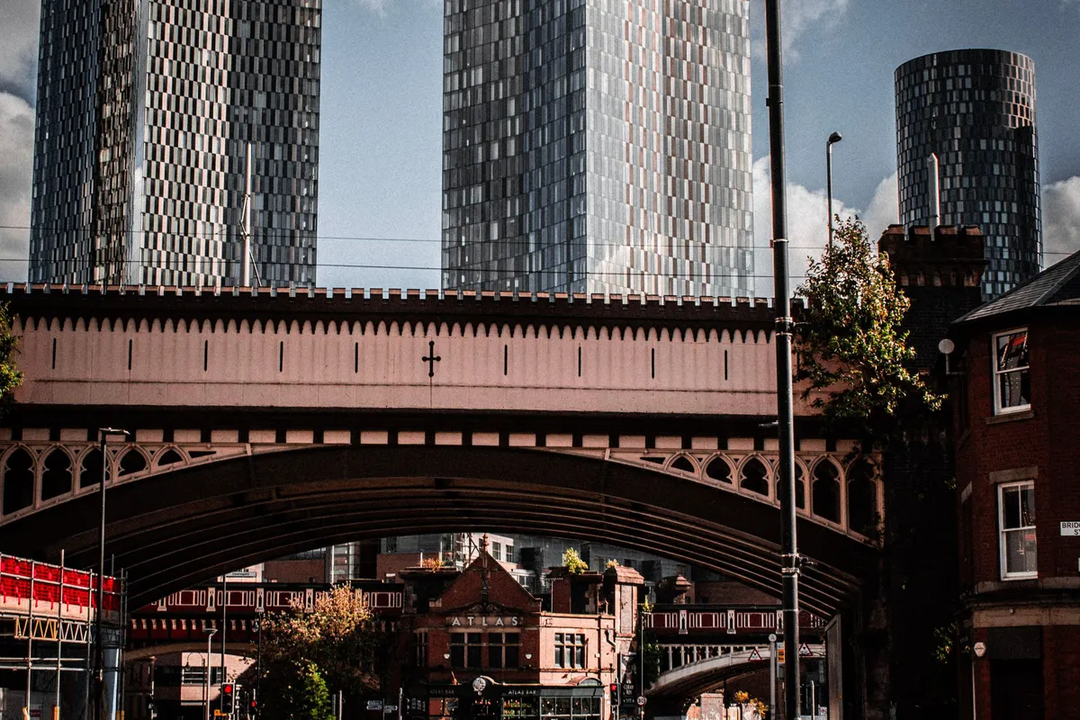 Victorian brick buildings and railway viaduct in a city centre, illustrative